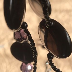 Dark purple beaded necklace, bracelet, earrings.
